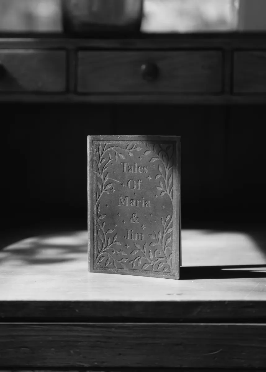 Close detail of engraved book invitation